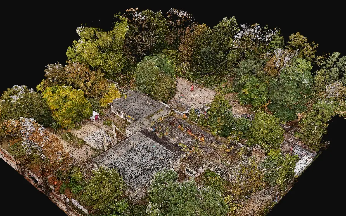 Oblique aerial view of a coloured point cloud: flat-roofed buildings, yards and trees